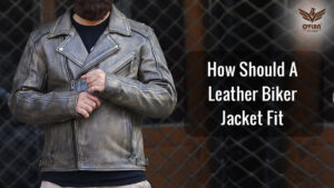 Person wearing a leather biker jacket with the text, "How Should A Leather Biker Jacket Fit."