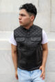 Man wearing an OVLAN black leather motorcycle vest with diamond stitching, paired with a white shirt and light blue jeans, showcasing a stylish side profile.