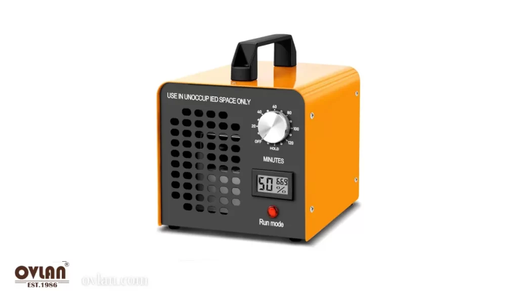 An orange air purifier with a digital timer and display, showing a 50% humidity level.
