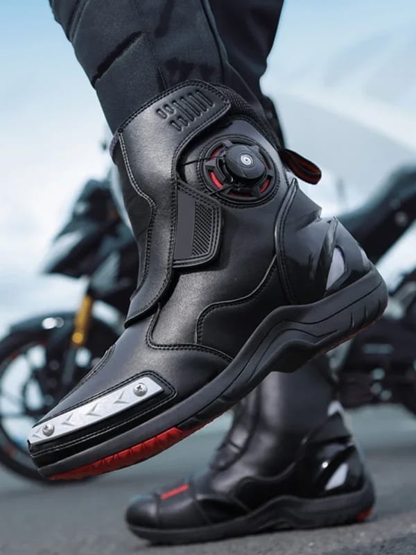 Close-up of a black motorcycle boot with advanced features.
